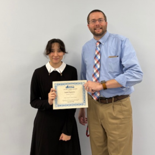 Sophia Wagatsuma, Collegiate Academy's Stairclimber for October, poses with his award plaque.